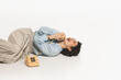 © master1305 - Happy, emotional, young woman lying on floor and talking on retro style phone, having fun on conversation, isolated on white. Concept of retro and vintage, fashion, human emotions, lifestyle
