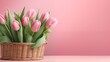 A tranquil display of pink tulips arranged in a wicker basket on a pastel background