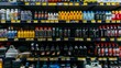 A store shelf filled with different types and brands of bottles, including motor oil, creating a diverse display