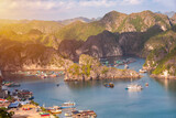 Fototapeta  - Sea landscape in Vietnam with many small islands and boats. View from above