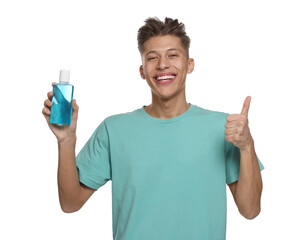 Canvas Print - Young man with mouthwash showing thumbs up on white background