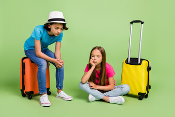 Poster - Full length photo of tired bored friends wear t-shirts going journey waiting delayed flight isolated green color background