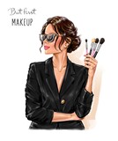 Fototapeta Miasta - Beautiful brunette hair woman holding makeup brushes. Makeup artist concept. Fashion illustration 