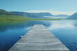 Lakeside Serenity: A tranquil scene of a wooden pier stretching into calm waters, surrounded by lush greenery, under a serene sky with fluffy clouds