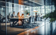 © melhak - Office Workspace with Glass Partition and Blurred Workers - Professional Environment, Corporate Setting, Privacy Concept.
