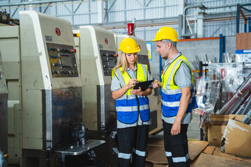 Wall Mural - professional business industry technician wearing safety helmet working to maintenance service and checking factory equipment, a work of engineer occupation in manufacturing construction technology