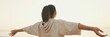 © Andrii Nekrasov - Asian girl in sportswear doing workout, breathing exercises, relaxing on modern buildings background at morning time, Back view, Panorama
