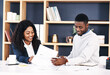 © peopleimages.com - Partners, paperwork and talking in office on deal, report and lawyers for reading contract. Black people, attorneys and speaking on documents or planning for company growth, teamwork and research