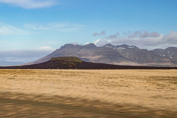 Wall Mural - landscape of yellow grass field with volcano mountain in Iceland at autumn
