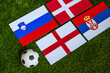 Football Tournament in Germany 2024: Group C and national flags of Slovenia, Denmark, Serbia, England and soccer ball on green grass