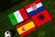 Spain Heads Group B: Flags of Spain, Croatia, Italy, Albania, and soccer ball on green grass at Europe football tournament in Germany in 2024
