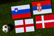 Group C at Europe football tournament in Germany in 2024. Flags of Slovenia, Denmark, Serbia, England and soccer ball on green grass