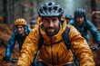© Good Shot - A man in a yellow jacket leading a mountain biking group in the woods.
