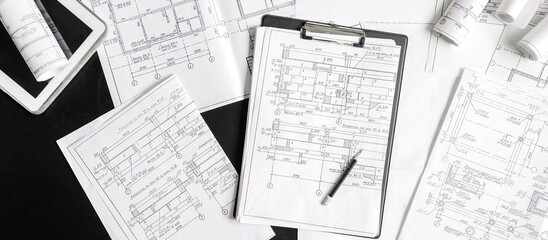 Architect works remotely from home in quarantine, lockdown covid 19 coronavirus. Remote work, stay home, new normality, social distance. Architect design working drawing sketch plans blueprints