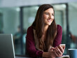 © peopleimages.com - Business, smartphone and woman with laptop thinking, text message or browsing for online social media. Connection, networking and communication, smile or notification or browse on company website