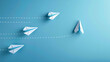A sequence of paper airplanes increasing in design complexity heading towards a target, illustrating progression and refinement in aims