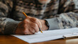 Conscientious Senior Reviewing and Signing Critical Financial Documents for Retirement and Estate Planning