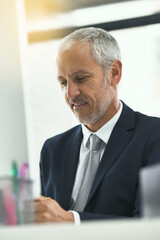 Poster - Computer, management and mature business man at desk in office as CEO of corporate company. Desktop, job and work with happy boss or manager at table in professional workplace for online report