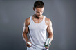 bodybuilder eating pills, steroids. Handsome Fitness Boy with medicine bottle