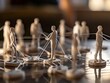 A series of figurines representing people linked by white lines, illustrating cooperation and interaction among individuals and employees