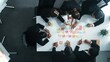 Top down ariel view of professional business team use colorful sticky notes brainstorming idea at meeting room. Diverse group share financial plan or project and point at whiteboard. Directorate.