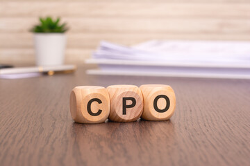 Poster - letters CPO written on wooden cubes. Cost Per Order concept