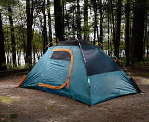 Canvas Print - Lit backpacking tent at a forest campsite