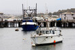 Two Fishing Boats Moored In Monterey Bay Near Docks