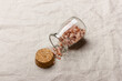 Himalayan pink salt in a glass jar with a cork
