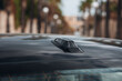 GPS antenna shark fin shape on a roof of car for radio navigation system.
