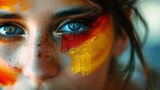 Fototapeta Kosmos - beautiful woman with her face painted with the flag of Germany in high resolution and high quality HD