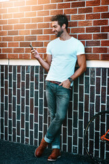 Poster - Thinking, happy and man in city with smartphone for mobile communication, urban life and chatting. Person, phone and online for conversation and connection for travel plans, social media and meme.