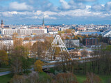 Fototapeta  - Construction of the observation wheel in Riga, Latvia. Beautiful ferris wheel in the Victory park in the center of Riga with a beautiful view of the old town.