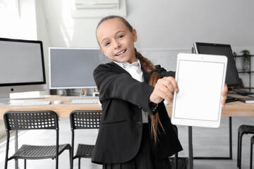 Wall Mural - Little girl with tablet at school computer lab