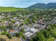 Drone photos over downtown Clayton, California with businesses, blue skies, green hills and room for text