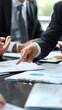 © Reyhan - image of male hand pointing at business document during discussion at meeting