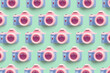 Pattern with SLR camera on pastel color background
