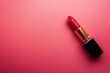 red lipstick on pink background with copy space	