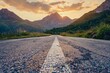 empty old paved road in mountain landscape at sunset low angle view travel and adventure concept