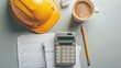 © SUYATI - Orange safety helmet or hard hat,coffee,calculator and construction paper plans on wood table background.