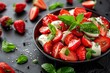 Caprese salad with strawberries mozzarella tomatoes basil on black background Healthy Italian cuisine