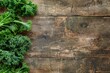 Fresh kale on wood background