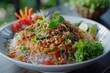 Thai clear vermicelli salad with spicy pork in white dish