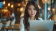 © admin_design - Elegant Young Businesswoman in Cafe with Laptop