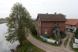 Fototapeta Konie - Estate on the banks of the Polesie Canal in the Kaliningrad region