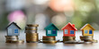 House model and coin concept of real estate management home investment and risk management. Successful real estate business marketing bokeh background real estate investment