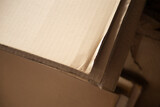 Fototapeta Tulipany - Cardboard boxes in a warehouse, close-up, selective focus