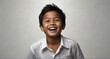 young indonesian child boy on plain bright white background laughing hysterically looking at camera background banner template ad marketing concept from Generative AI