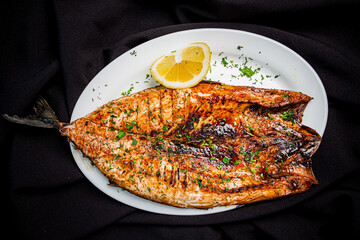 Wall Mural - grilled fish on the white plate