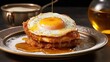 stack of fluffy pancakes topped with a generous drizzle of maple syrup and a sunny-side-up egg